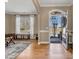 Welcoming home foyer with hardwood floors and plenty of natural light at 1857 Felts Pkwy, Fort Mill, SC 29715