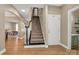 The foyer features hardwood floors and staircase, providing a welcoming entrance to the home at 1857 Felts Pkwy, Fort Mill, SC 29715