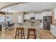 Modern kitchen featuring a peninsula, counter seating, and stainless steel appliances at 1857 Felts Pkwy, Fort Mill, SC 29715