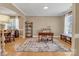 Neutral living room featuring a console table, seating area, and natural light at 1857 Felts Pkwy, Fort Mill, SC 29715