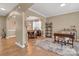 Bright living room featuring an archway, hardwood floors, and dining room at 1857 Felts Pkwy, Fort Mill, SC 29715