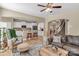 Spacious living room featuring wood floors, neutral colors, and a view to the kitchen at 1857 Felts Pkwy, Fort Mill, SC 29715