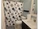 Bathroom featuring a sink with modern fixtures, and a shower with a decorative shower curtain at 190 Glastonbury Dr, Mooresville, NC 28115