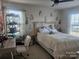 Cozy bedroom with desk space and unique decor above the headboard at 190 Glastonbury Dr, Mooresville, NC 28115