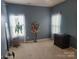 Serene bedroom with neutral walls, lots of natural light, and a walk in closet at 190 Glastonbury Dr, Mooresville, NC 28115