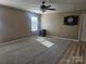 Versatile bonus room with neutral carpet, a ceiling fan, and natural light, perfect for recreation or hobbies at 190 Glastonbury Dr, Mooresville, NC 28115