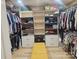 Spacious walk-in closet with shelves, drawers, hanging racks, and seating at 190 Glastonbury Dr, Mooresville, NC 28115