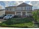 Charming two-story home featuring manicured lawn, covered entry, and attached two-car garage at 190 Glastonbury Dr, Mooresville, NC 28115