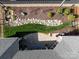 Aerial view of the landscaped backyard and patio space of this beautiful home, showcasing the outdoor living areas at 2011 Trailwood Dr, Matthews, NC 28104