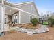 Charming backyard showcasing a stone pathway, manicured garden, and outdoor seating area at 2011 Trailwood Dr, Matthews, NC 28104