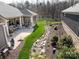 Expansive backyard featuring a screened in porch, landscaped garden, and well-maintained lawn at 2011 Trailwood Dr, Matthews, NC 28104