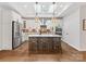 Modern kitchen with quartz countertops, a center island, and stainless steel appliances, perfect for culinary enthusiasts at 2011 Trailwood Dr, Matthews, NC 28104