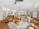 Spacious living area with hardwood flooring, built-in shelves, and stylish furnishings perfect for comfortable living at 2011 Trailwood Dr, Matthews, NC 28104