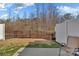 Fenced backyard with a patio and sparse grass at 2149 Bexar Trl, Matthews, NC 28105