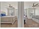 Bright bedroom with two beds, two ceiling fans, and multiple windows offering natural light at 2149 Bexar Trl, Matthews, NC 28105