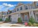 Charming two-story townhome with a one-car garage, neutral siding, and a well-maintained front yard at 2149 Bexar Trl, Matthews, NC 28105