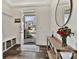 Inviting foyer with wood-look flooring, coat rack and bench, and a view of the exterior at 2149 Bexar Trl, Matthews, NC 28105