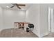 Bright home office with a large corner desk and carpeting at 2149 Bexar Trl, Matthews, NC 28105