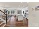 Open-concept living area with modern kitchen, dining area, and a cozy living room with abundant natural light at 2149 Bexar Trl, Matthews, NC 28105