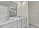 Modern main bathroom featuring a double vanity and shower with subway tile at 2149 Bexar Trl, Matthews, NC 28105