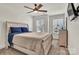 Spacious main bedroom featuring a ceiling fan, natural light, and a dresser at 2149 Bexar Trl, Matthews, NC 28105