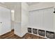Functional mudroom with built-in storage, hooks, and a convenient entry to the bathroom and hallway at 2149 Bexar Trl, Matthews, NC 28105