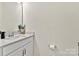 Clean and modern powder room featuring a vanity with a white countertop at 2149 Bexar Trl, Matthews, NC 28105