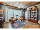 Charming living room featuring a wooden ceiling, ample natural light, stylish furnishings, and a colorful area rug at 2359 Currant St, Fort Mill, SC 29715