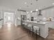 Modern kitchen featuring white cabinetry, stainless steel appliances, and a large island with seating at 261 Supernova Dr, York, SC 29745