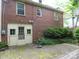 The backyard features a brick patio and verdant landscaping at 2815 Glendale Rd, Charlotte, NC 28209