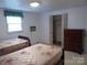 Bedroom featuring twin beds, closet and dresser, offering cozy comfort at 2815 Glendale Rd, Charlotte, NC 28209