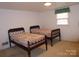 Cozy bedroom furnished with twin beds; a comforting and inviting space at 2815 Glendale Rd, Charlotte, NC 28209