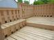 Wooden deck with built-in bench seating, offering a peaceful outdoor space at 2815 Glendale Rd, Charlotte, NC 28209