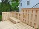 Outdoor deck area with built-in bench seating and lovely view at 2815 Glendale Rd, Charlotte, NC 28209