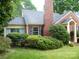 Charming brick home with a well-manicured front yard and mature landscaping at 2815 Glendale Rd, Charlotte, NC 28209