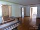 Open living area with hardwood floors and views into adjacent rooms at 2815 Glendale Rd, Charlotte, NC 28209