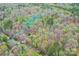 Aerial view of the property showing boundaries surrounded by a lush, wooded landscape at 2819 Blythe Rd, Waxhaw, NC 28173