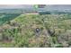 Aerial view of the property near Downtown Waxhaw surrounded by a lush, wooded landscape at 2819 Blythe Rd, Waxhaw, NC 28173