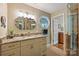 This bathroom features a granite countertop, unique octagon window, tile floors, and glass shower doors at 2819 Blythe Rd, Waxhaw, NC 28173