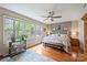 Bedroom with hardwood flooring, ceiling fan and ensuite bath at 2819 Blythe Rd, Waxhaw, NC 28173