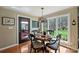 Cozy dining area provides easy access to the outdoor patio and beautifully wooded back yard at 2819 Blythe Rd, Waxhaw, NC 28173