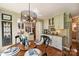 Dining area features stylish light fixture and easy access to the updated kitchen at 2819 Blythe Rd, Waxhaw, NC 28173