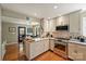 Updated kitchen features granite countertops, stainless steel appliances and hardwood flooring at 2819 Blythe Rd, Waxhaw, NC 28173