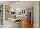 Updated kitchen features granite countertops, stainless steel appliances and hardwood flooring at 2819 Blythe Rd, Waxhaw, NC 28173