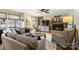 Inviting living room features a stone fireplace, hardwood floors, large windows, and comfortable seating at 2819 Blythe Rd, Waxhaw, NC 28173