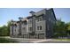 Modern townhome featuring an attached garage, board and batten siding, and large windows for natural light at 3003 Casting St # 12, Charlotte, NC 28206