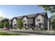 Charming two-story townhouse featuring gray siding, black trim, and inviting front entrances at 3003 Casting St # 12, Charlotte, NC 28206