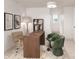 Cozy home office with patterned wallpaper, a wood desk, and stylish green chairs at 3003 Casting St # 12, Charlotte, NC 28206