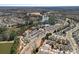 Panoramic aerial view showcases a vibrant community with a clubhouse, pool, and lush landscape at 3100 Azalea Dr, Fort Mill, SC 29707