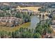 Community view showcasing a lake, clubhouse, and well-maintained landscaping in a serene setting at 3100 Azalea Dr, Fort Mill, SC 29707